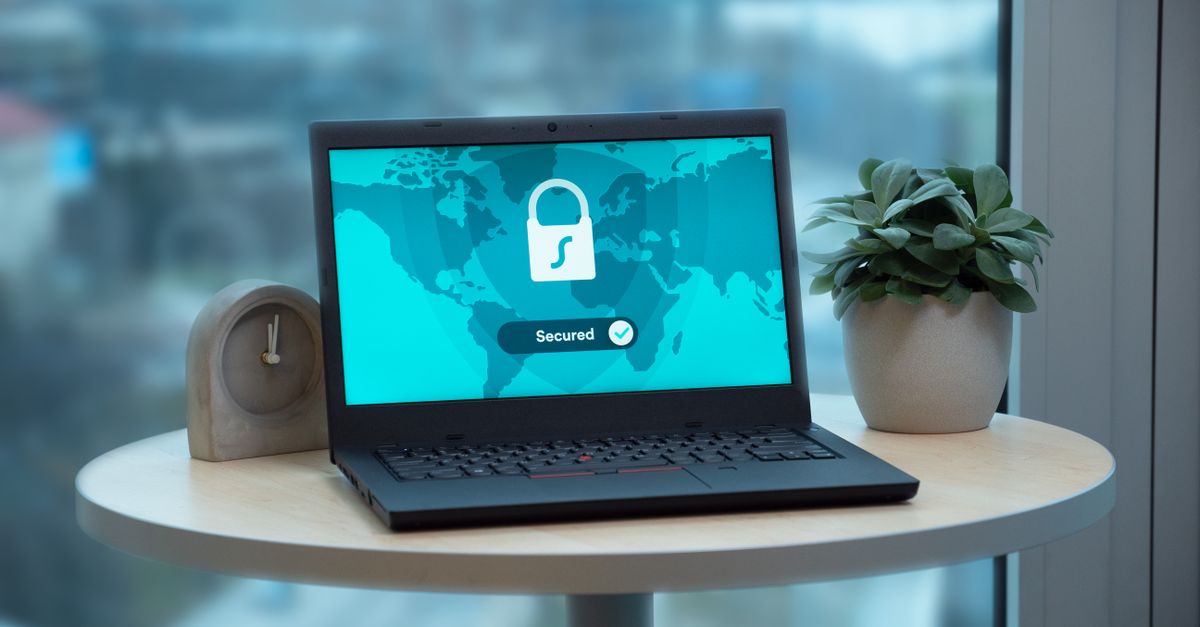 A laptop showing a security lock icon — the data protection a Data Protection Officer independently oversees.