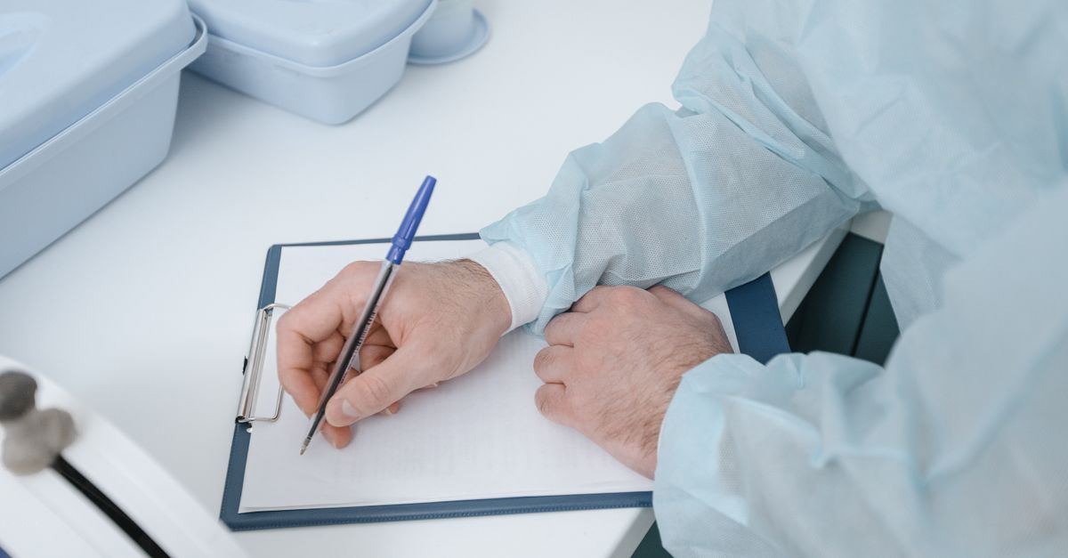 Reviewing medical records — a HIPAA compliance audit scene for a SaaS vendor.