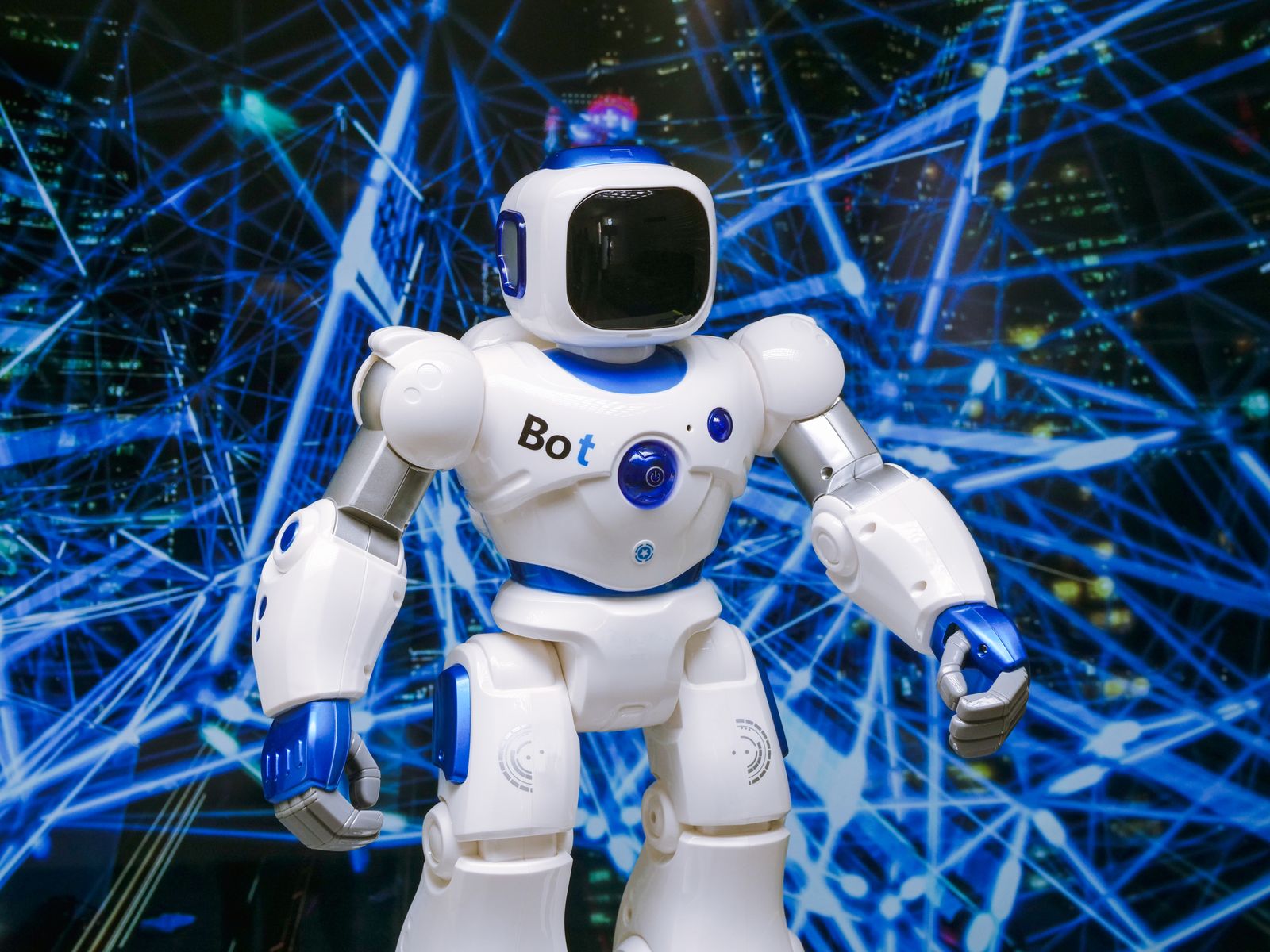 A humanoid robot with glowing blue accents set against a digital network background.